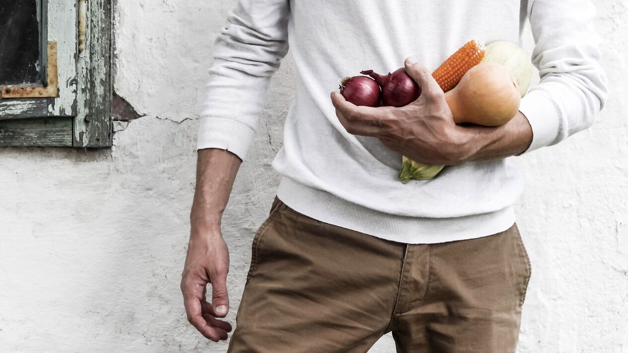 Men with healthy food for potency